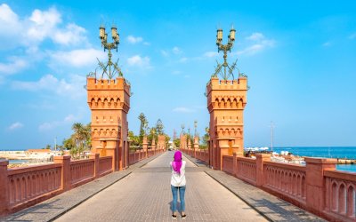 Woman standing on Montaza Bridge in Alexandria, Egypt.